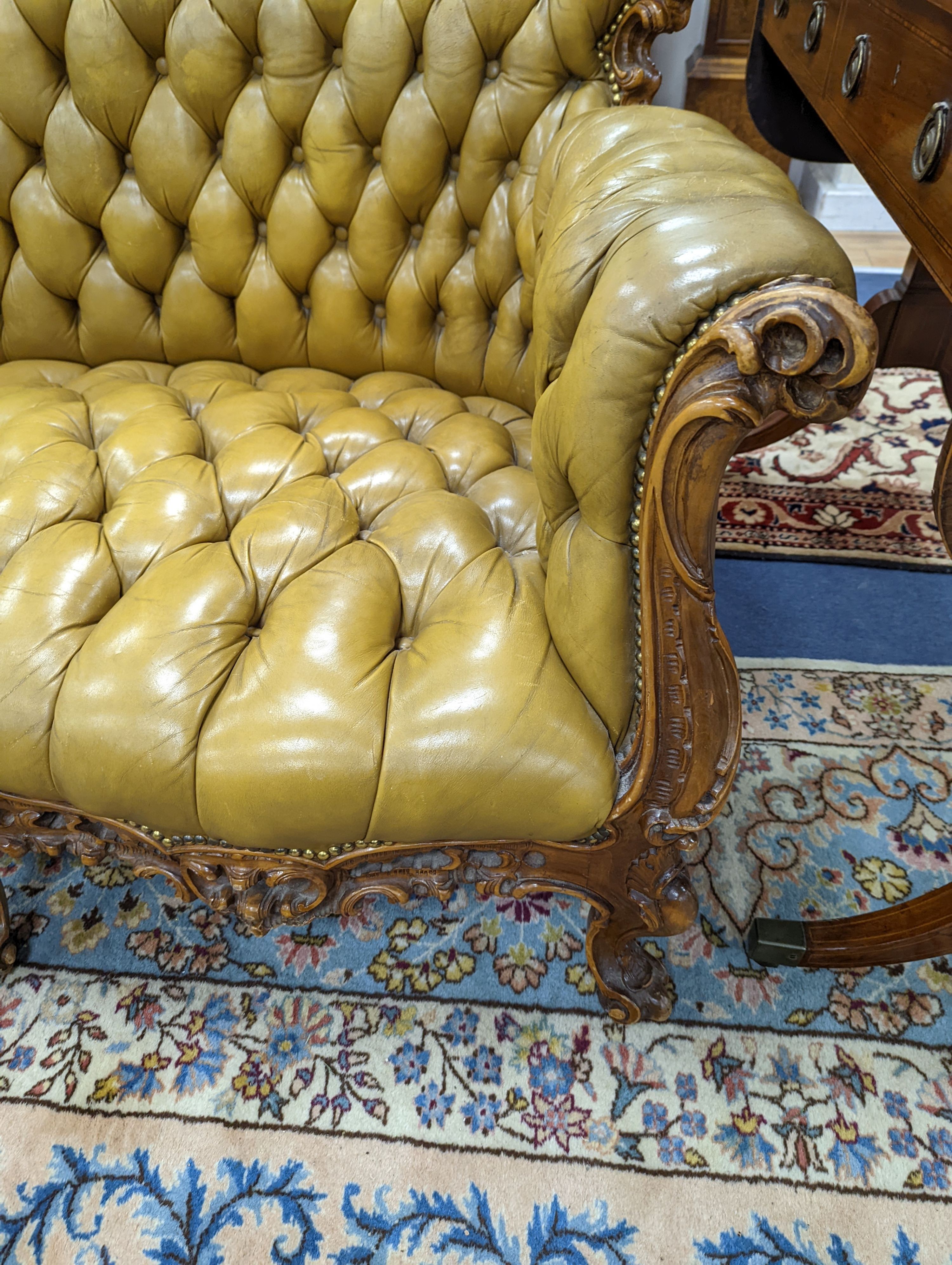 A Louis XVI design settee upholstered in buttoned olive leather, length 190cm, depth 70cm, height 99cm